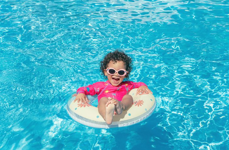 Little girl floating down myrtle beach lazy river at Coral Beach