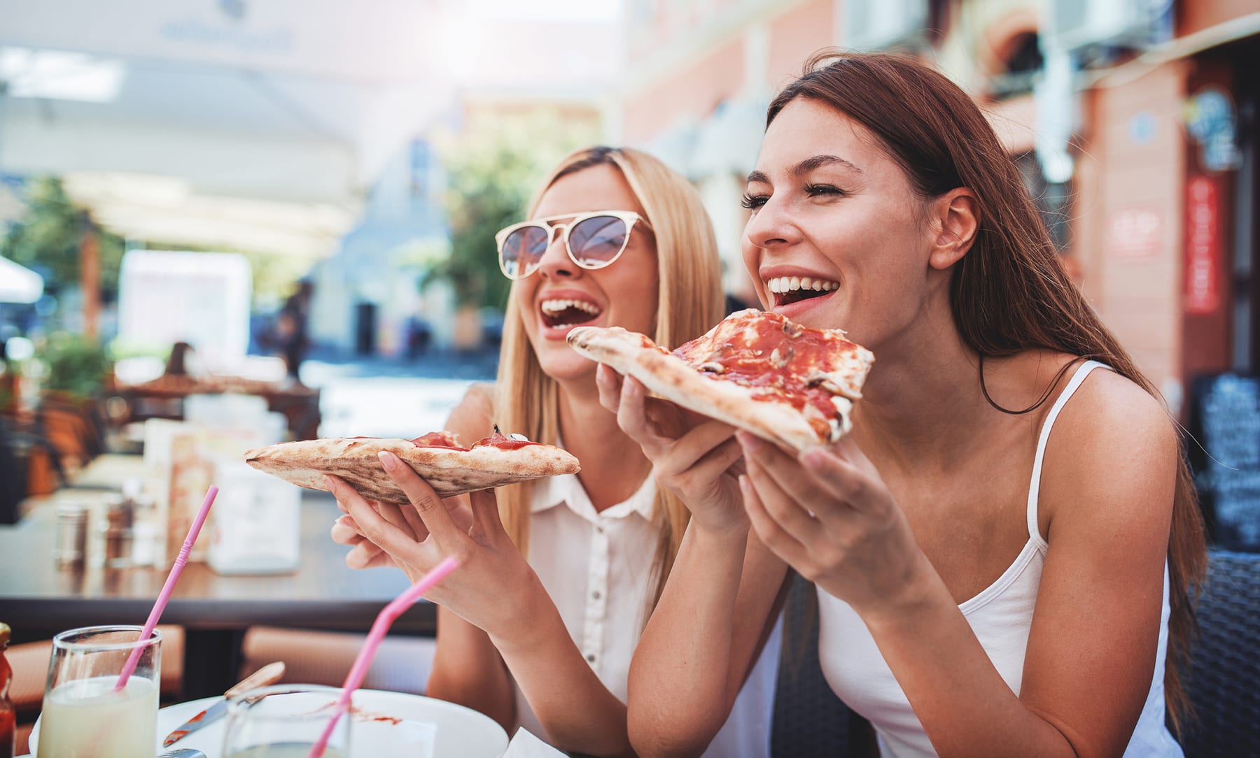 Girls enjoying pizza at restaurants near myrtle beach boardwalk