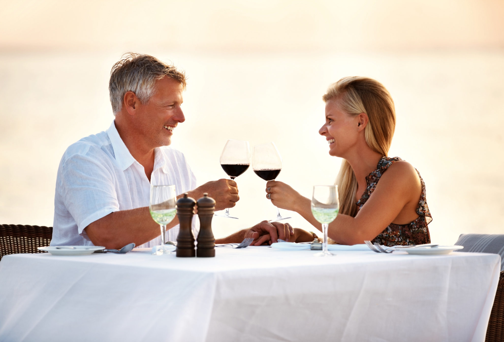 Mature couple enjoying a meal at an oceanfront restaurant in Myrtle Beach
